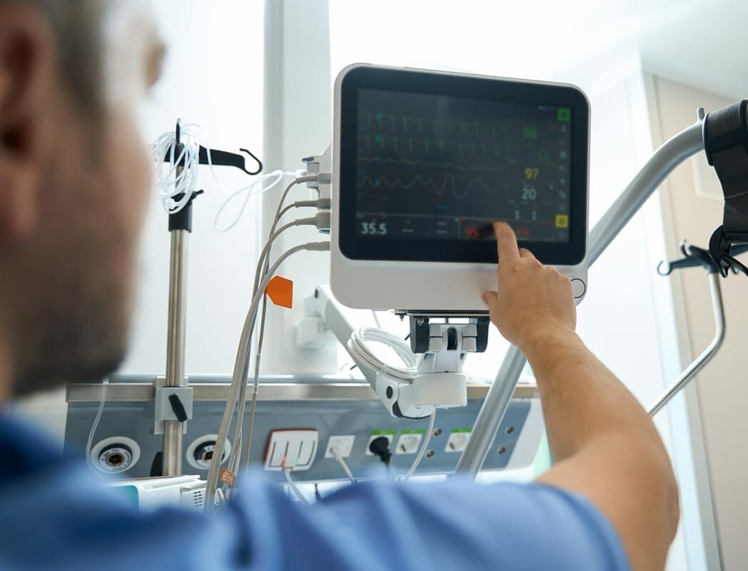 Healthcare professional operating a medical device