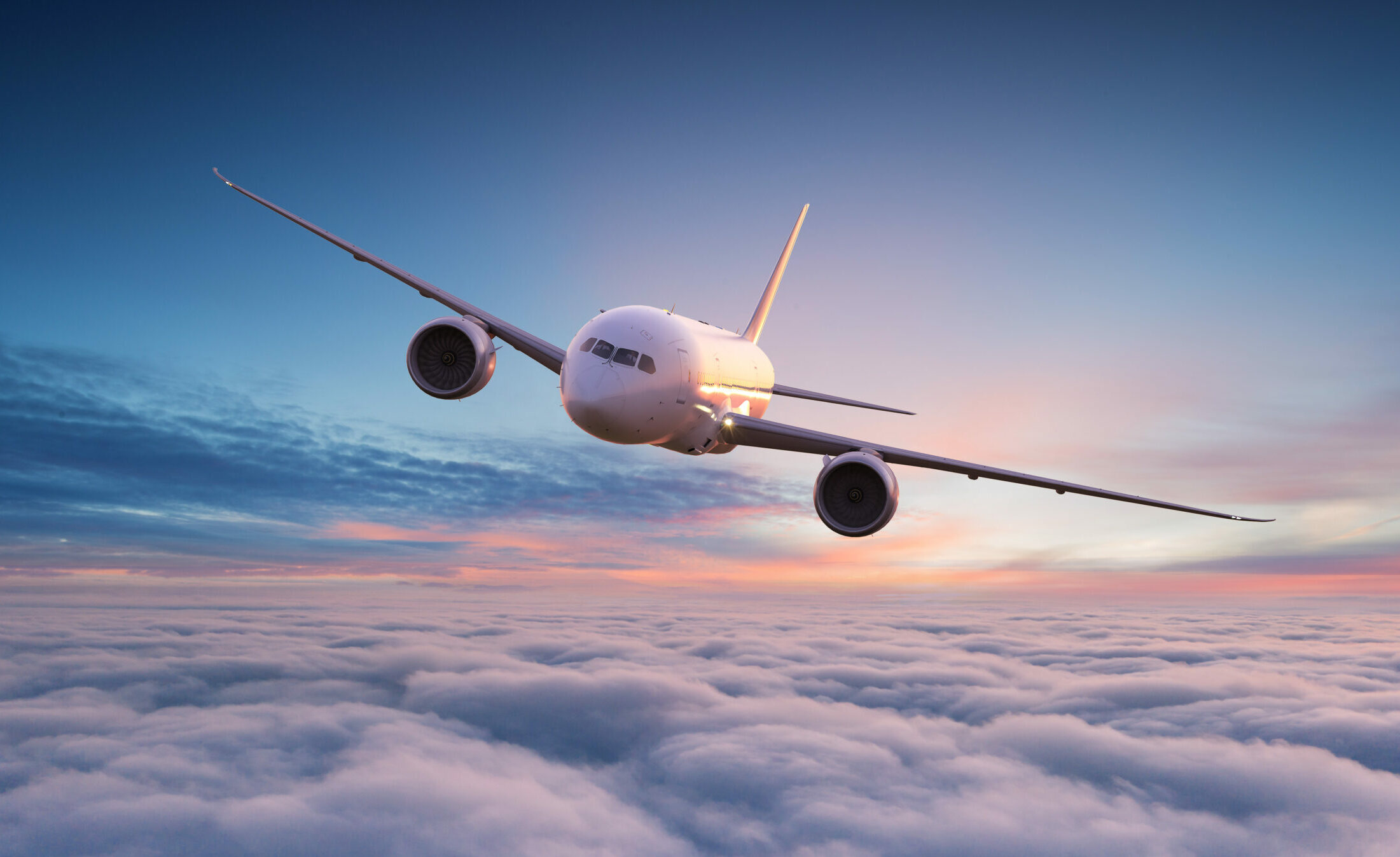 Aeroplane flying above clouds at sunrise representing CRYOPDP Singapore global reach