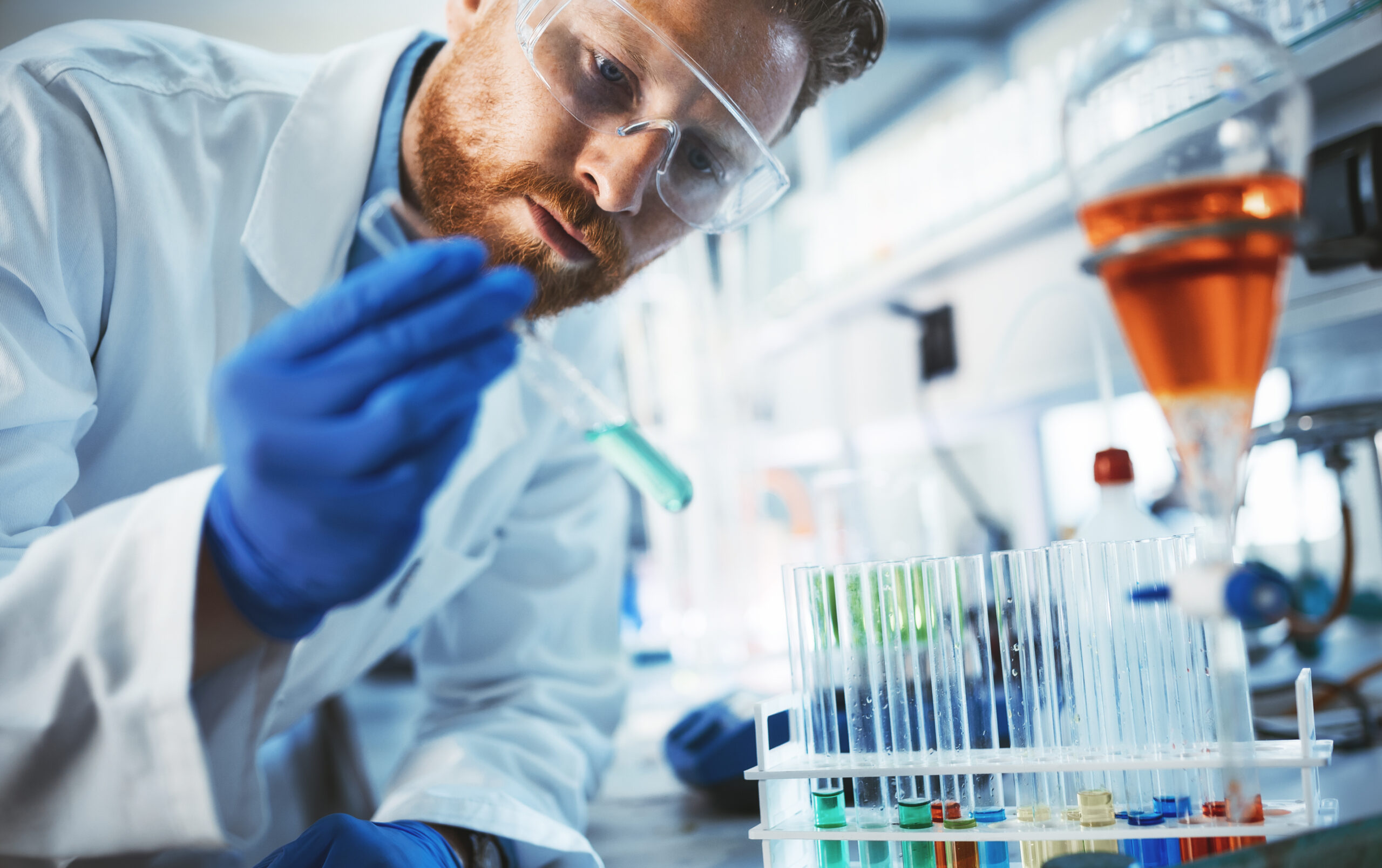Scientist handling lab samples in a controlled environment