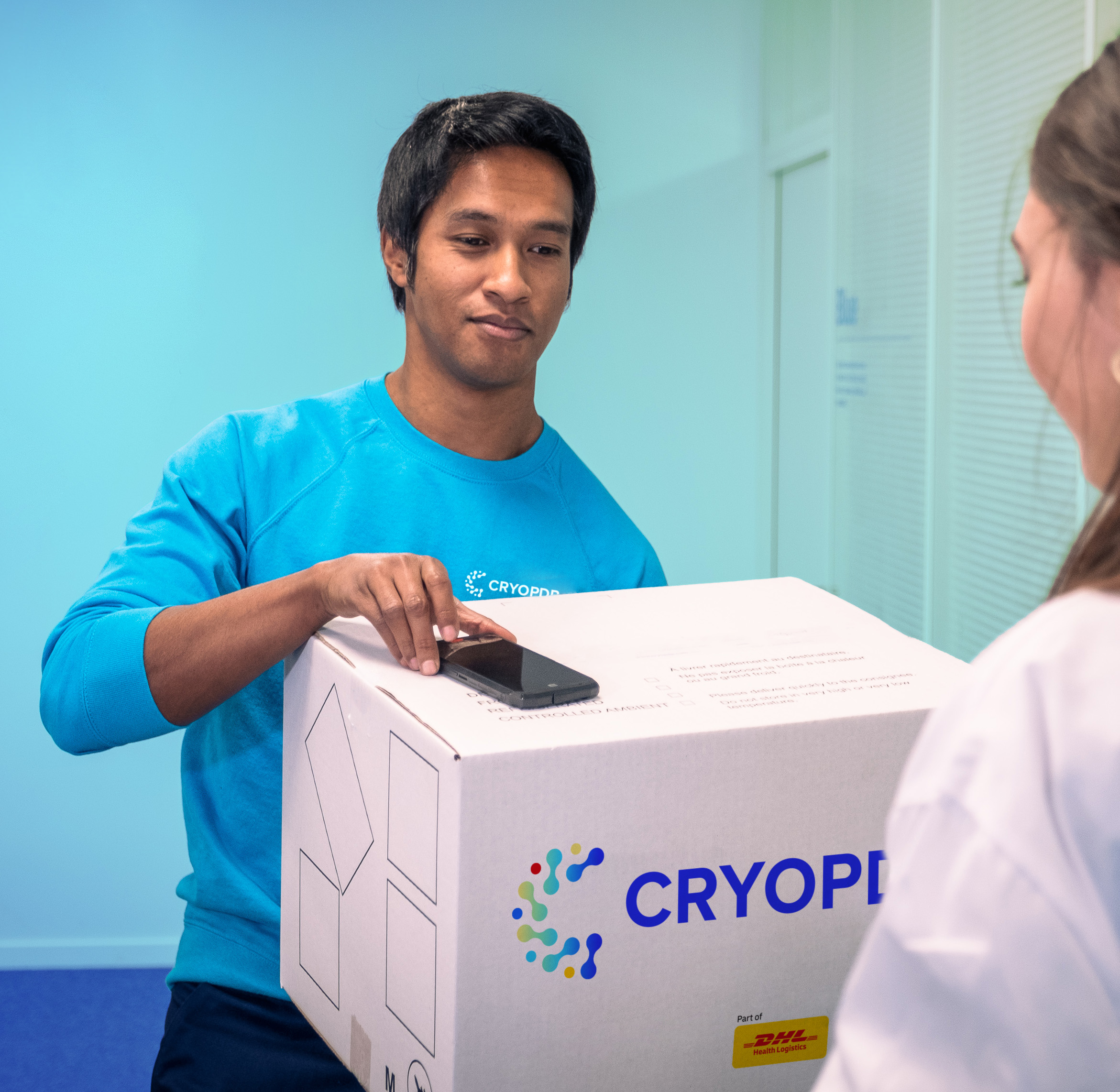Hand pointing at monitor with graph, illustrating direct-to-patient data transfer in CRYOPDP CRM Oversight.