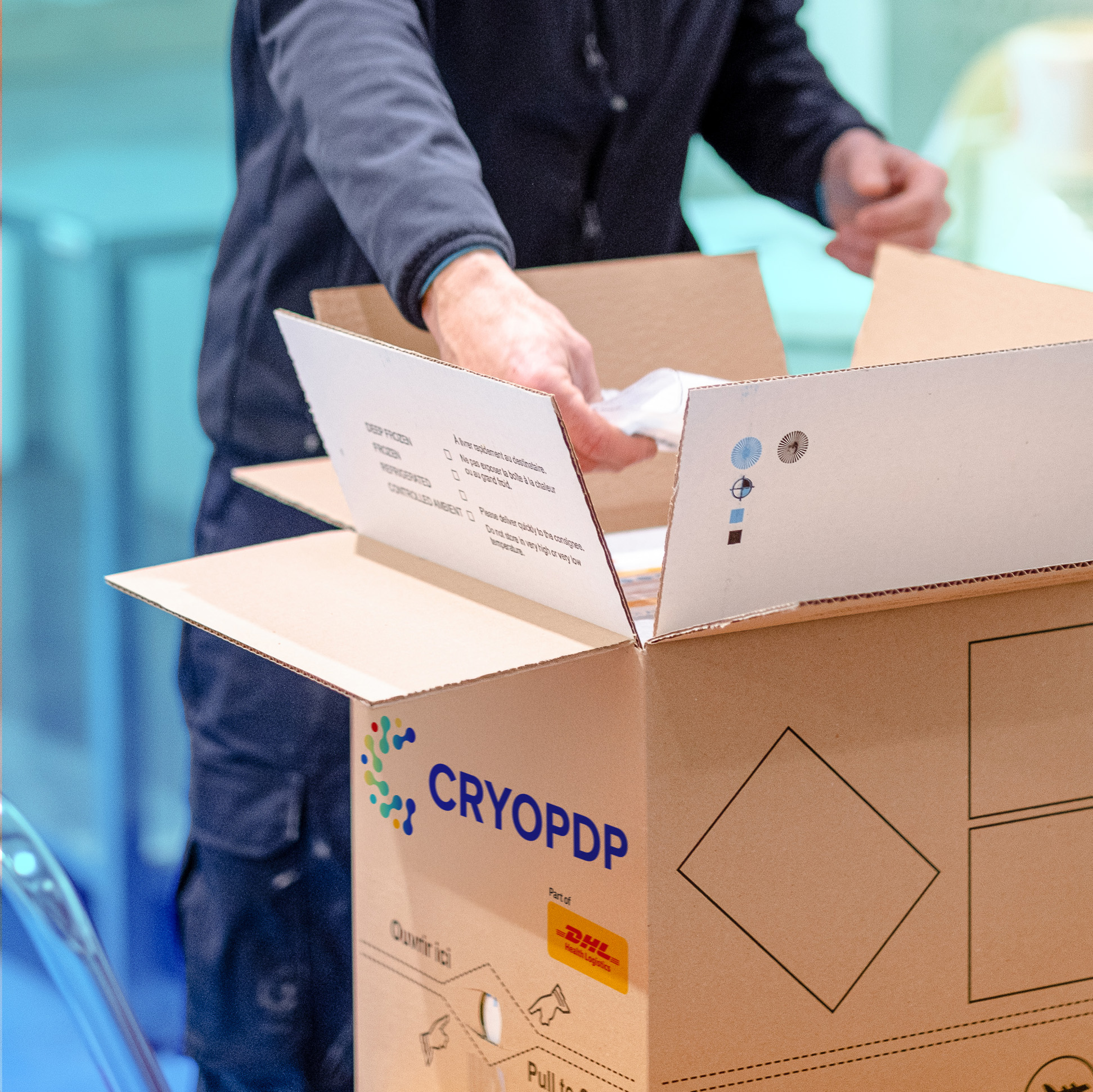 CRYOPDP technician preparing a temperature-controlled logistics shipment