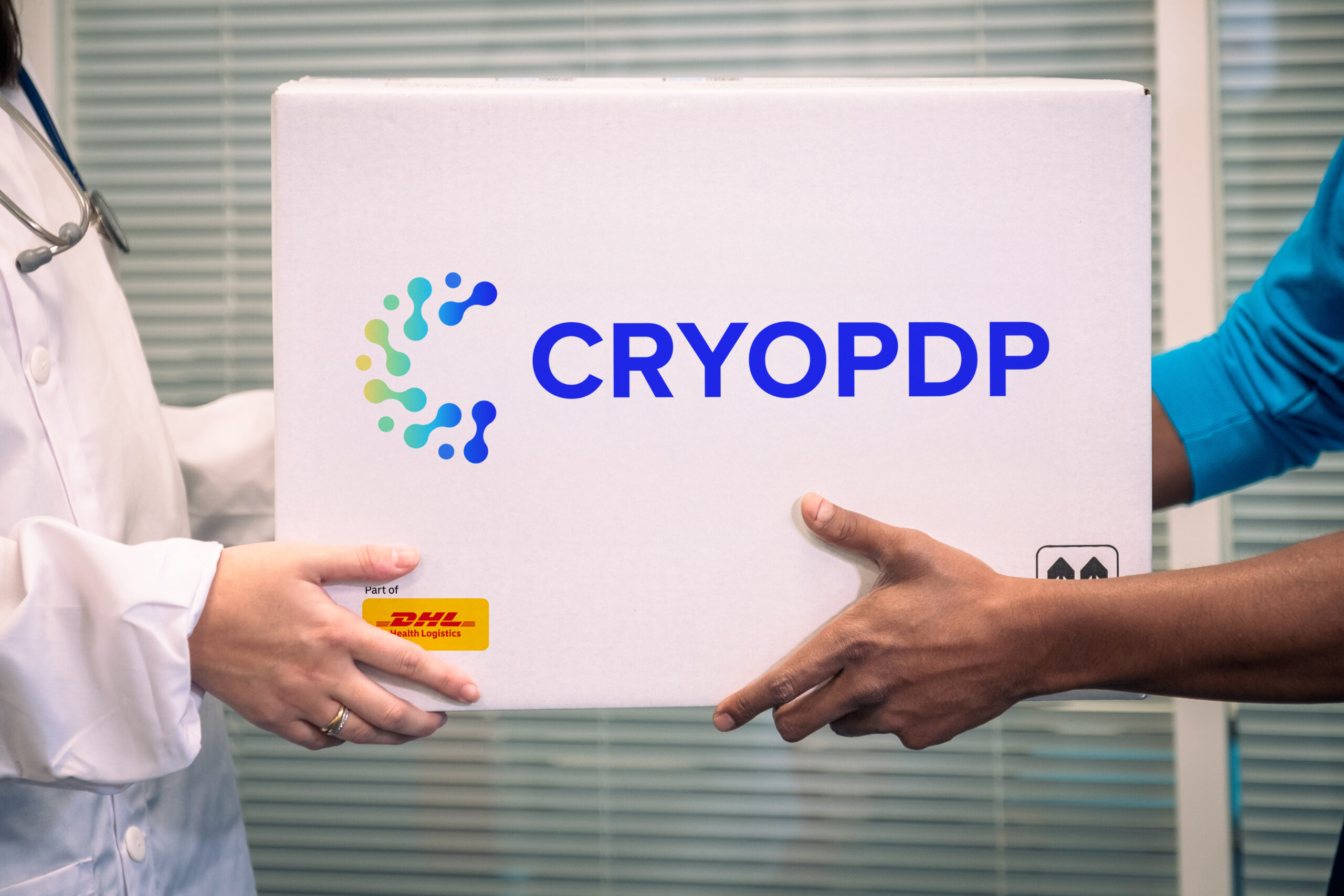 Two people handling a CRYOPDP cold chain shipment box