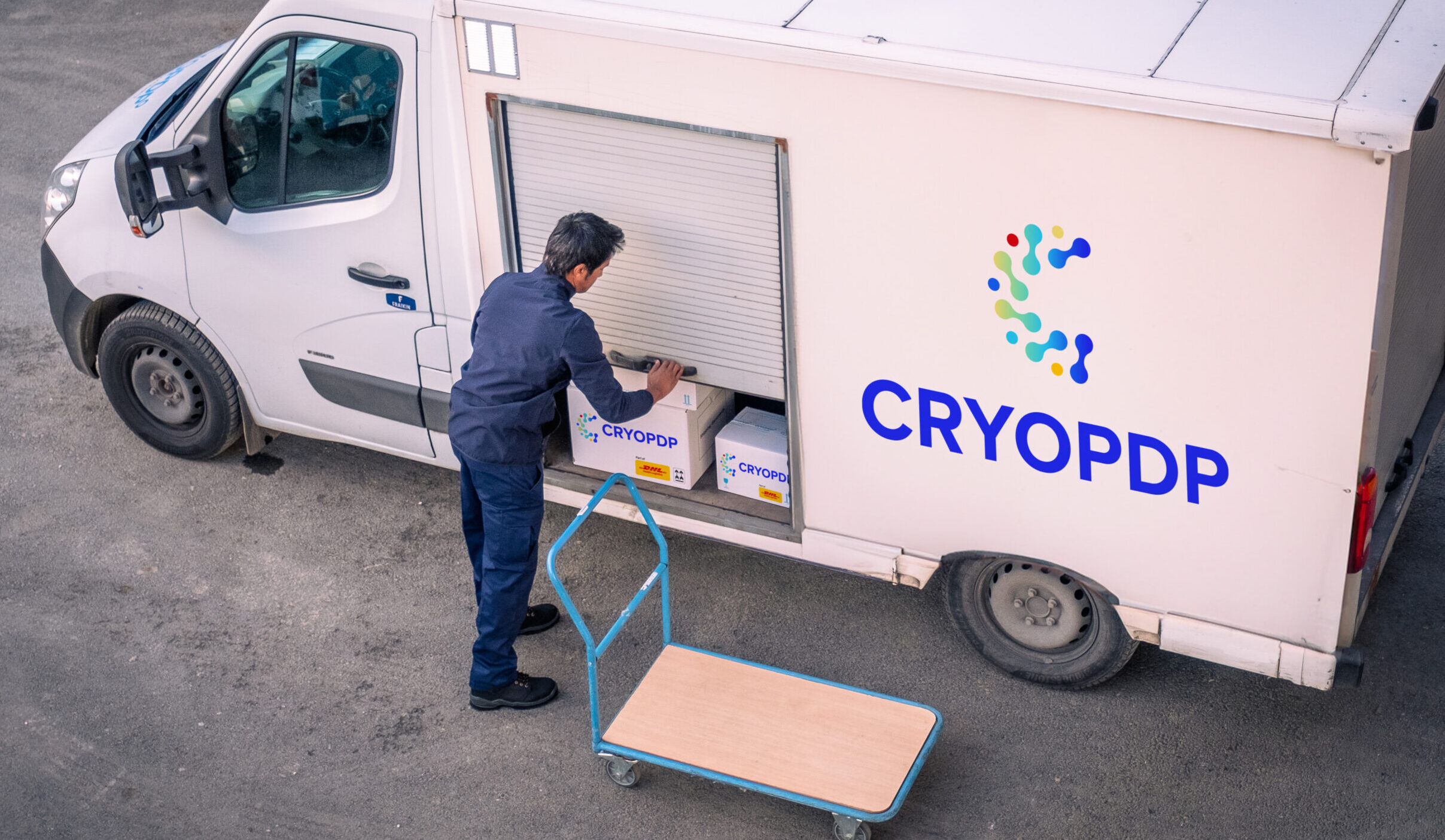 CRYOPDP driver loading a temperature-controlled van with clinical trial logistics solutions ready for delivery.