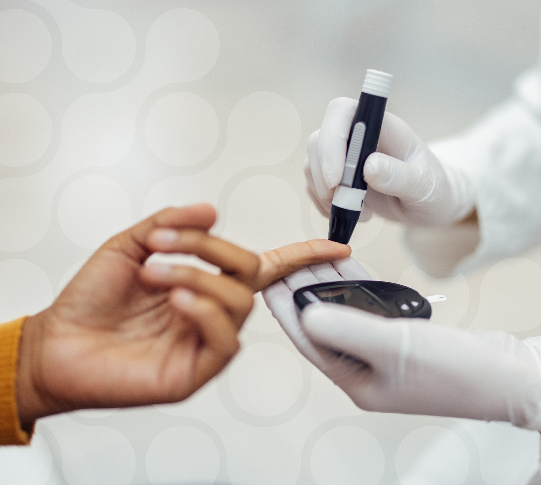 Hands during a blood glucose test, showing a healthcare professional checking a patient’s finger.
