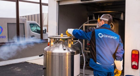 CRYOPDP technician handling cryogenic equipment during a medical device shipment